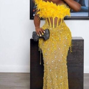 Sleycrafts Yellow feathers and beaded fish-dress